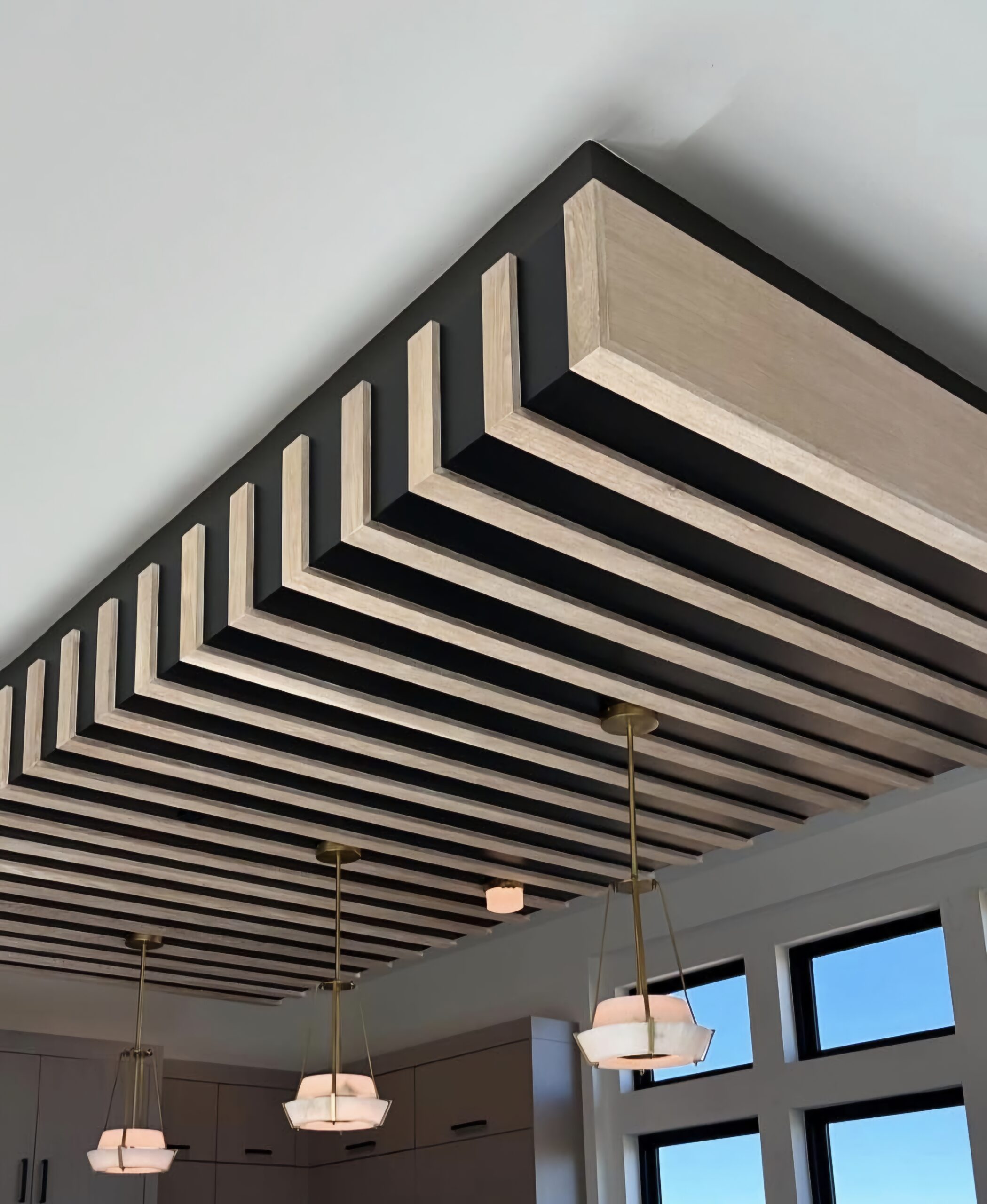 Custom Millwork design of a Fluted Ceiling Bulkhead