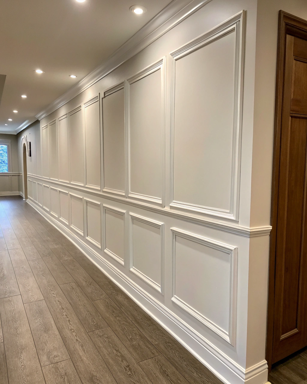 Best trim carpenter showcasing floor to ceiling wainscoting