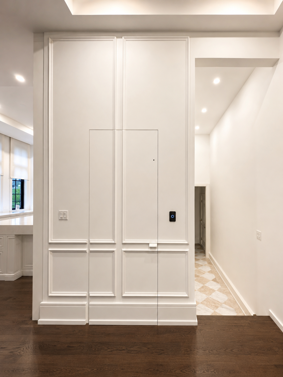 Specialty interior door integrated with decorative wall panelling