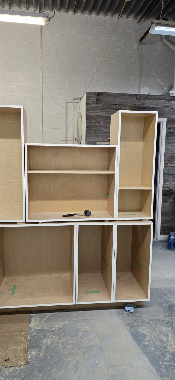 Prefinished birch plywood kitchen and laundry cabinet boxes in the Miter5 workshop