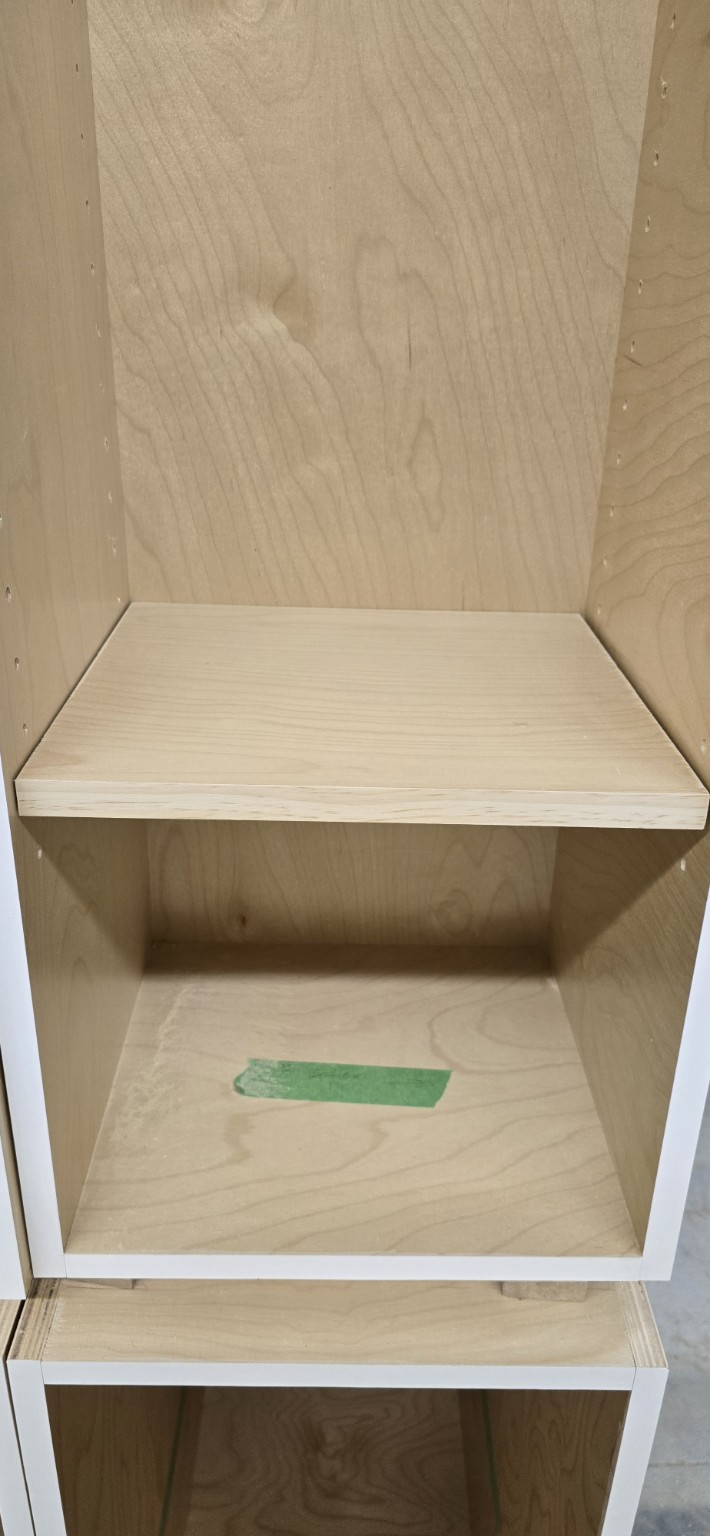 Close view of a three-quarter-inch prefinished birch plywood cabinet and shelf